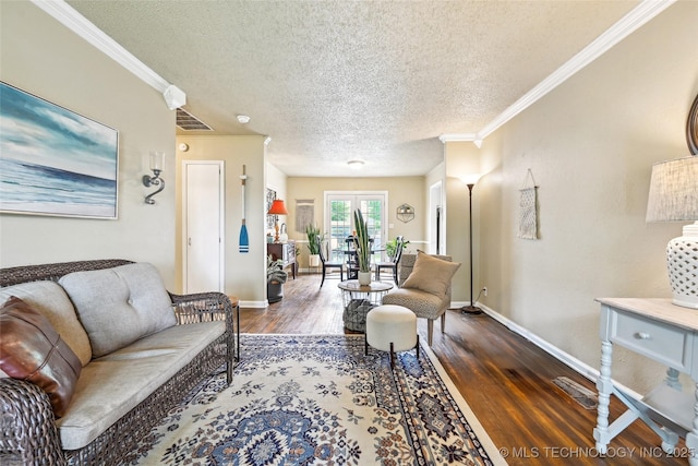 3508 E 30th St, Tulsa, OK 74114 - living room featuring a textured ceiling, ornamental molding, dark wood-type flooring, and baseboards