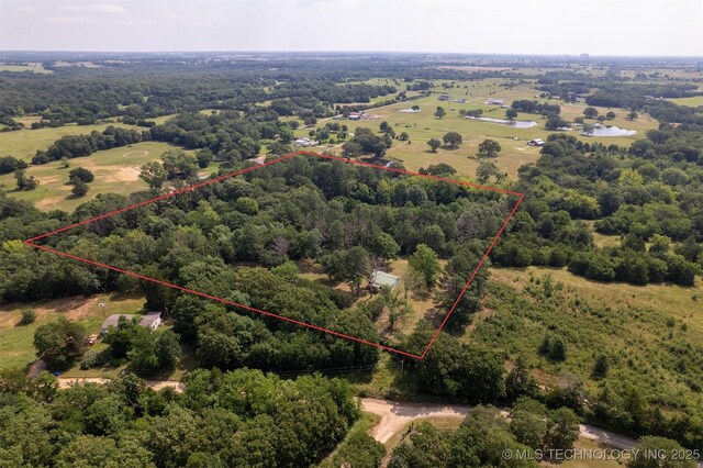 5164 Smiser Rd, Calera, OK 74730 - view of property location with property boundaries highlighted and a forest