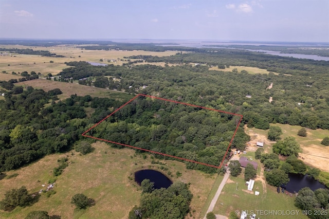 5164 Smiser Rd, Calera, OK 74730 - view of property location with a nearby body of water, property parcel outlined, and a forest
