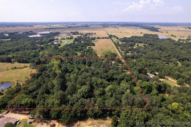 5164 Smiser Rd, Calera, OK 74730 - aerial view of property and surrounding area featuring a heavily wooded area and property boundaries highlighted