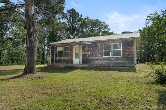 5164 Smiser Rd, Calera, OK 74730 - view of front of house featuring a front lawn and metal roof