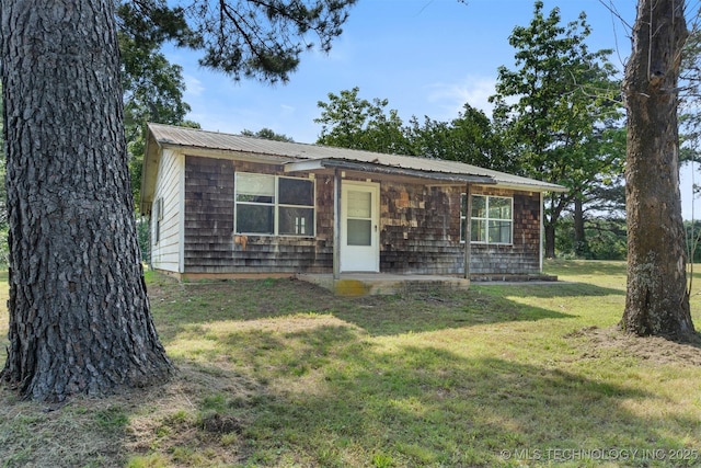 5164 Smiser Rd, Calera, OK 74730 - view of front of property featuring a front lawn and metal roof