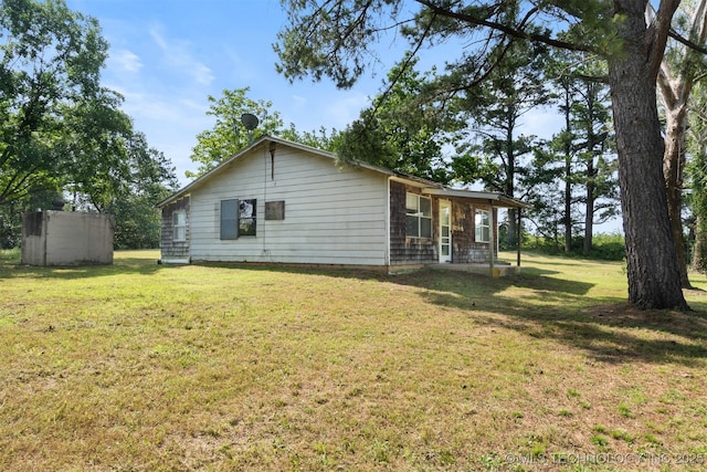 5164 Smiser Rd, Calera, OK 74730 - back of property featuring a yard