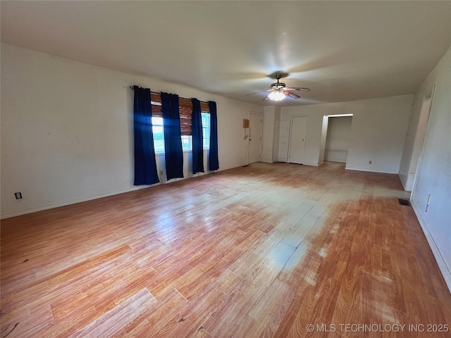5006 S 449th Ave W, Jennings, OK 74038 - unfurnished room featuring ceiling fan, light wood-type flooring, and baseboards