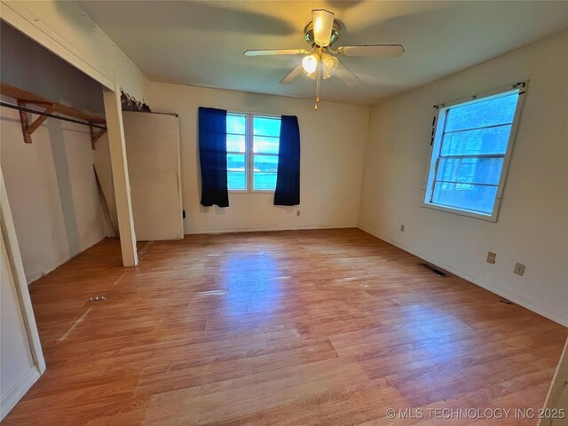 5006 S 449th Ave W, Jennings, OK 74038 - unfurnished bedroom with light wood finished floors and a ceiling fan