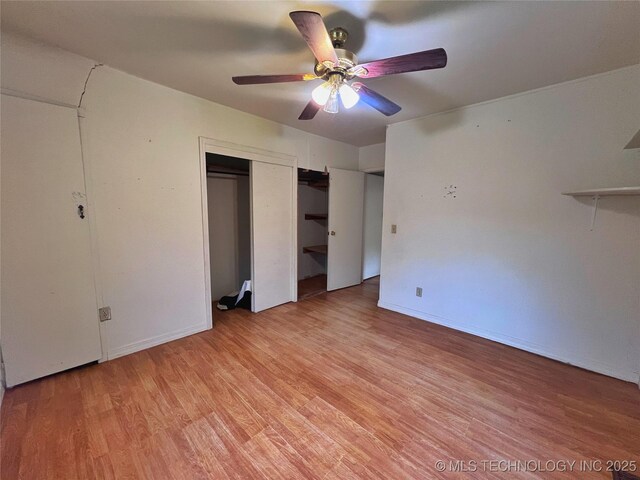5006 S 449th Ave W, Jennings, OK 74038 - unfurnished bedroom featuring light wood-style floors, a ceiling fan, a closet, and baseboards