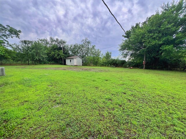 5006 S 449th Ave W, Jennings, OK 74038 - view of grassy yard featuring cooling unit