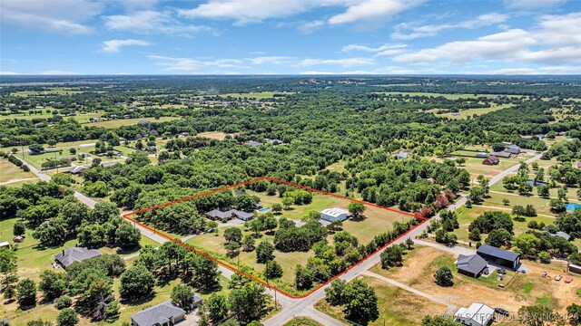 7023 Myall Rd, Lone Grove, OK 73443 - aerial view of property and surrounding area featuring property boundaries highlighted and a heavily wooded area