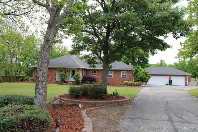 7023 Myall Rd, Lone Grove, OK 73443 - ranch-style home featuring a front lawn, brick siding, and asphalt driveway