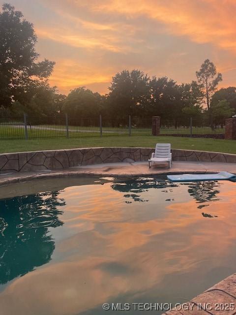 7023 Myall Rd, Lone Grove, OK 73443 - view of pool at dusk