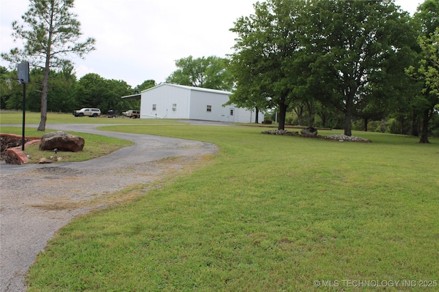 7023 Myall Rd, Lone Grove, OK 73443 - view of green lawn featuring driveway