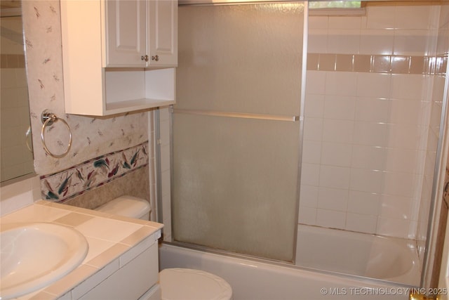 7023 Myall Rd, Lone Grove, OK 73443 - full bathroom with toilet, vanity, and enclosed tub / shower combo