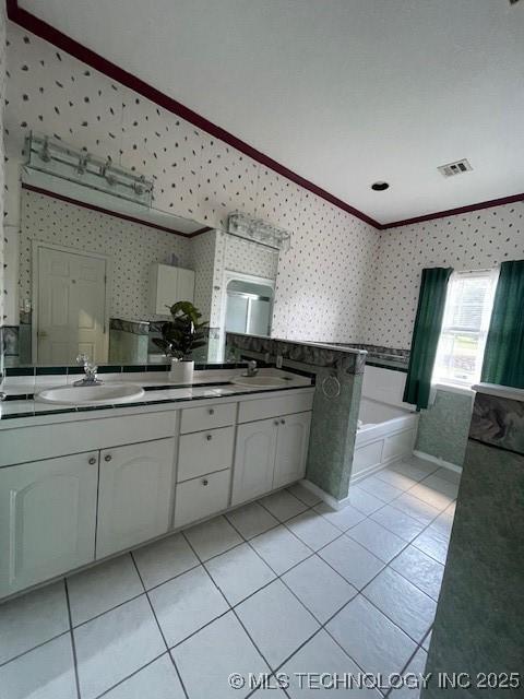 7023 Myall Rd, Lone Grove, OK 73443 - bathroom with wallpapered walls, ornamental molding, double vanity, tile patterned floors, and a bath