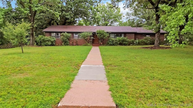 2506 Haskell Blvd, Muskogee, OK 74403 - ranch-style house featuring a front yard and brick siding