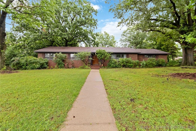 2506 Haskell Blvd, Muskogee, OK 74403 - ranch-style house featuring brick siding and a front lawn