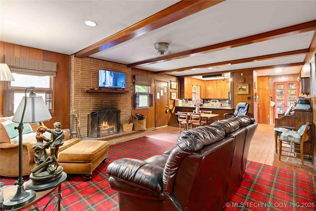 2506 Haskell Blvd, Muskogee, OK 74403 - living room with wood walls, a brick fireplace, beamed ceiling, and recessed lighting