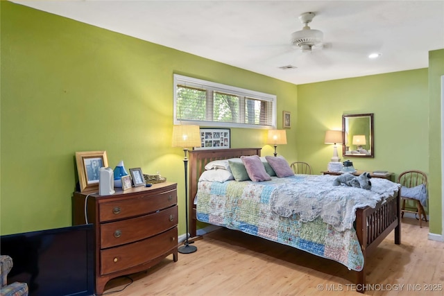 2506 Haskell Blvd, Muskogee, OK 74403 - bedroom with wood finished floors, ceiling fan, and baseboards