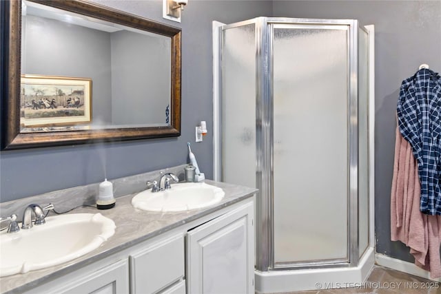 2506 Haskell Blvd, Muskogee, OK 74403 - bathroom featuring a stall shower and double vanity