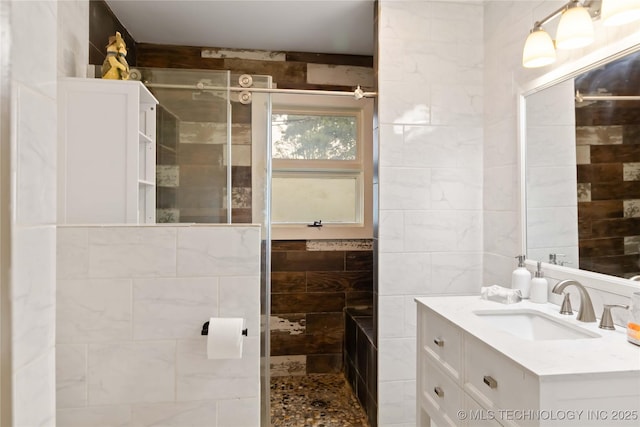 2506 Haskell Blvd, Muskogee, OK 74403 - full bathroom featuring vanity, tiled shower, and tile walls