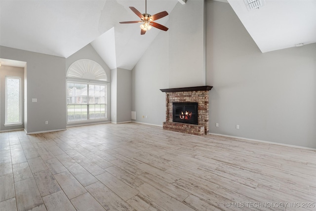 1802 S Fir Pl, Broken Arrow, OK 74012 - unfurnished living room featuring a ceiling fan, light wood-style flooring, high vaulted ceiling, a brick fireplace, and baseboards