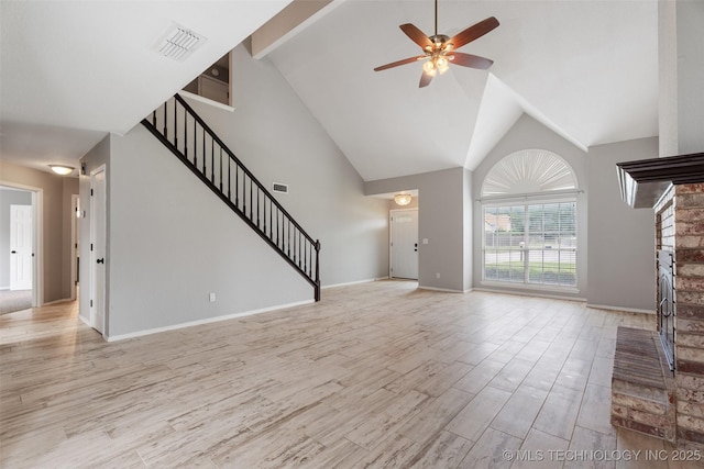 1802 S Fir Pl, Broken Arrow, OK 74012 - unfurnished living room with stairway, high vaulted ceiling, ceiling fan, a brick fireplace, and light wood-type flooring