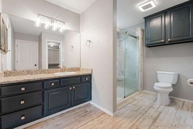 1802 S Fir Pl, Broken Arrow, OK 74012 - full bathroom featuring vanity, toilet, a marble finish shower, and wood finished floors