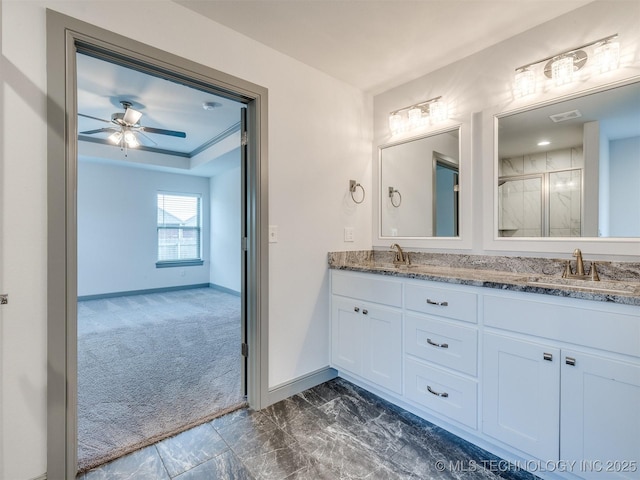 17710 E 45th Pl S, Tulsa, OK 74134 - bathroom with double vanity, baseboards, a stall shower, marble finish flooring, and ceiling fan