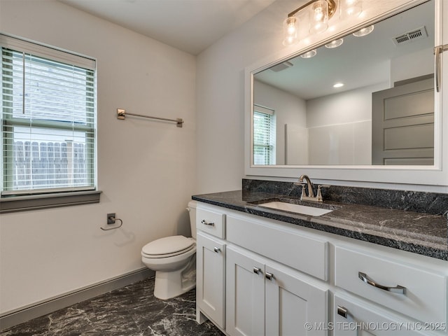 17710 E 45th Pl S, Tulsa, OK 74134 - bathroom featuring marble look tiles, vanity, toilet, and baseboards
