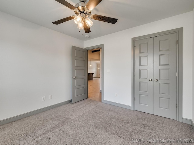 17710 E 45th Pl S, Tulsa, OK 74134 - unfurnished bedroom with carpet floors, a closet, baseboards, and a ceiling fan