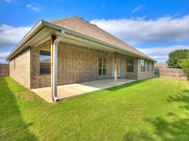17710 E 45th Pl S, Tulsa, OK 74134 - rear view of house with brick siding, a patio area, and roof with shingles
