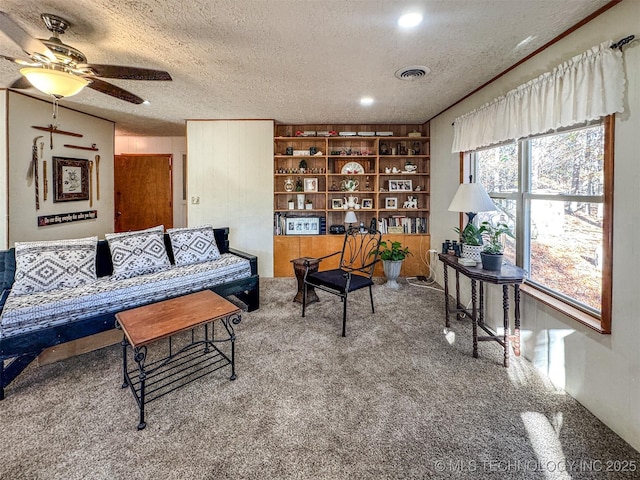 2064 Cave Creek Ct, Kansas, OK 74347 - carpeted living room with a textured ceiling and a ceiling fan