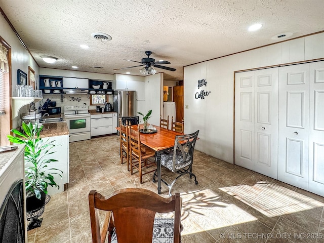 2064 Cave Creek Ct, Kansas, OK 74347 - dining room with ceiling fan, a textured ceiling, and recessed lighting