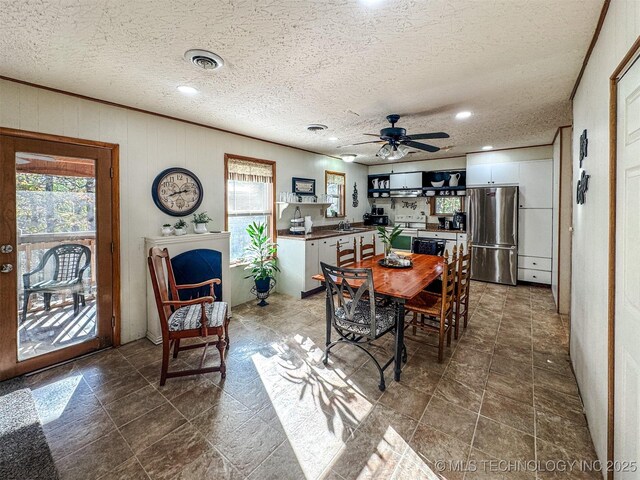 2064 Cave Creek Ct, Kansas, OK 74347 - dining room with plenty of natural light, ceiling fan, a textured ceiling, and recessed lighting