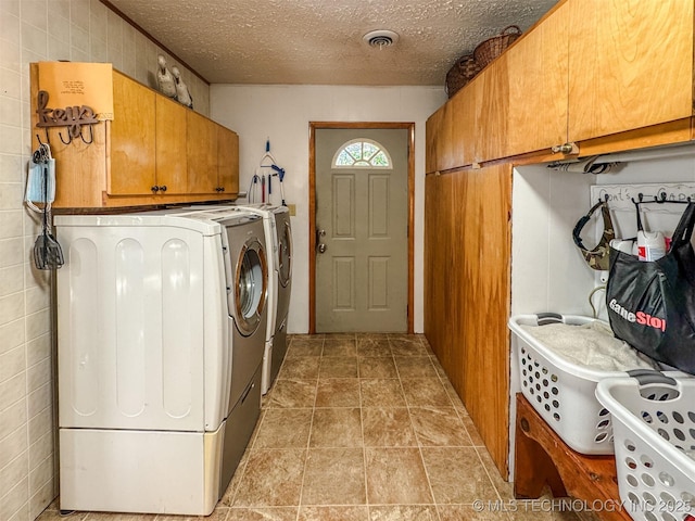 2064 Cave Creek Ct, Kansas, OK 74347 - laundry room with cabinet space, separate washer and dryer, and a textured ceiling
