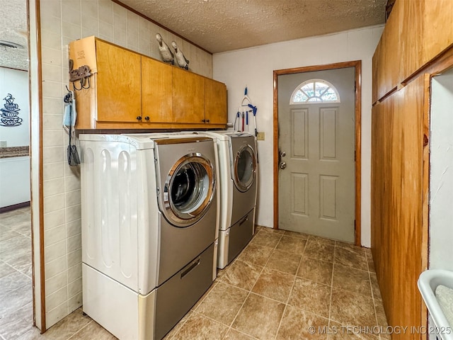 2064 Cave Creek Ct, Kansas, OK 74347 - laundry room featuring cabinet space, separate washer and dryer, and a textured ceiling