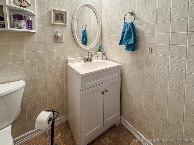 2064 Cave Creek Ct, Kansas, OK 74347 - bathroom with vanity, tile patterned flooring, tile walls, and toilet