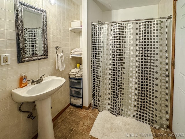 2064 Cave Creek Ct, Kansas, OK 74347 - bathroom with tile patterned flooring, a shower with shower curtain, and tile walls