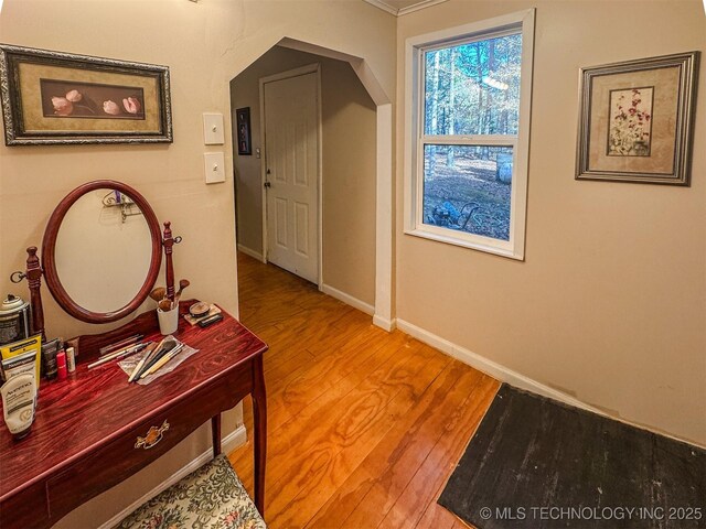 2064 Cave Creek Ct, Kansas, OK 74347 - hallway with wood finished floors, baseboards, and arched walkways