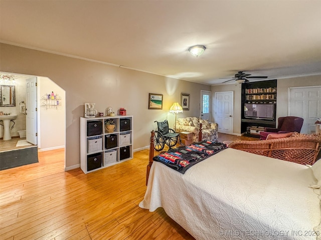 2064 Cave Creek Ct, Kansas, OK 74347 - bedroom featuring hardwood / wood-style flooring, crown molding, baseboards, and a ceiling fan