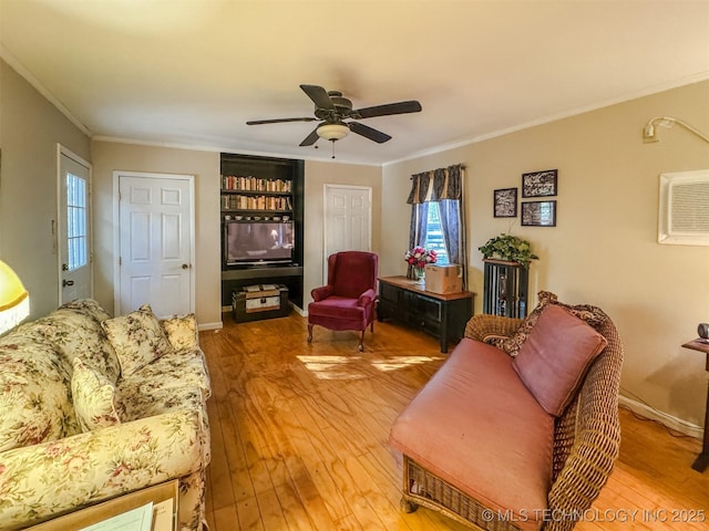 2064 Cave Creek Ct, Kansas, OK 74347 - living room with hardwood / wood-style flooring, ornamental molding, a ceiling fan, and healthy amount of natural light