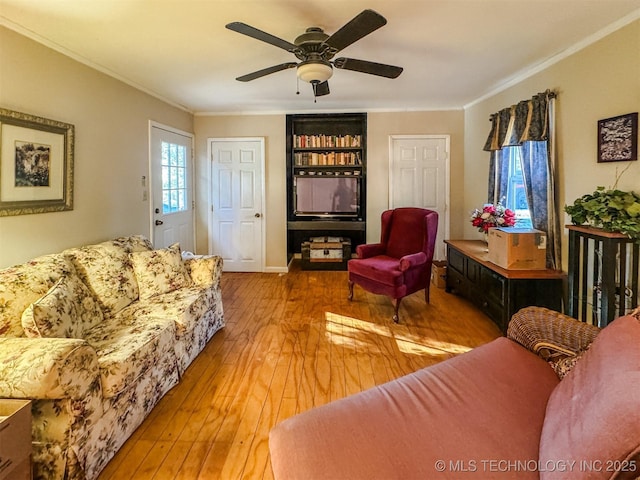 2064 Cave Creek Ct, Kansas, OK 74347 - living room featuring crown molding, hardwood / wood-style flooring, and a ceiling fan