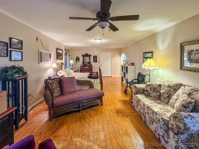 2064 Cave Creek Ct, Kansas, OK 74347 - living area featuring hardwood / wood-style flooring, crown molding, ceiling fan, and a wall unit AC