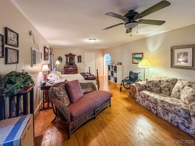 2064 Cave Creek Ct, Kansas, OK 74347 - living room with crown molding, hardwood / wood-style floors, a wall unit AC, and a ceiling fan