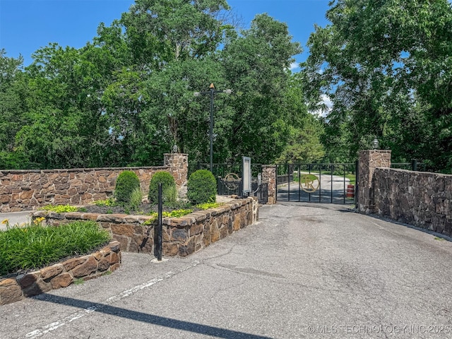 2064 Cave Creek Ct, Kansas, OK 74347 - gate with view of scattered trees