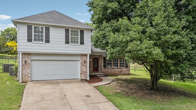 8602 S 91st E Ave, Tulsa, OK 74133 - view of front of property with brick siding, roof with shingles, driveway, and an attached garage