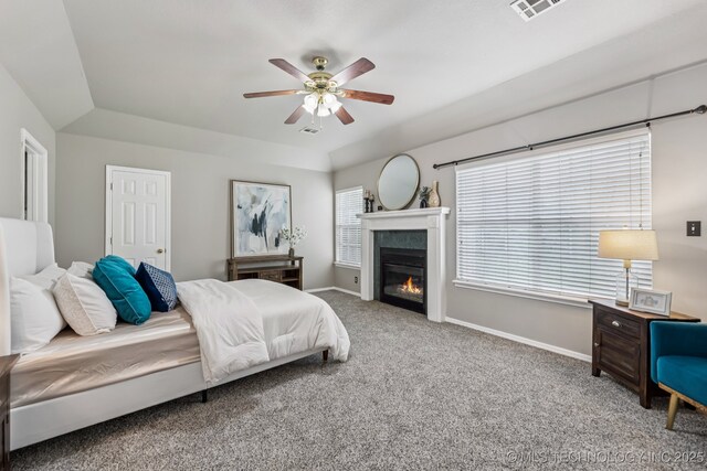 8602 S 91st E Ave, Tulsa, OK 74133 - carpeted bedroom with a glass covered fireplace and ceiling fan