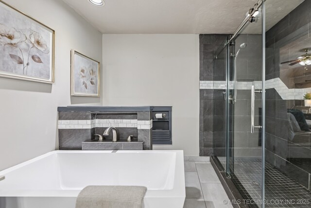 8602 S 91st E Ave, Tulsa, OK 74133 - full bath featuring a tub, a stall shower, a ceiling fan, recessed lighting, and tile patterned floors