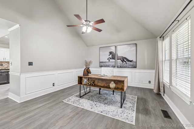 8602 S 91st E Ave, Tulsa, OK 74133 - office with vaulted ceiling, a ceiling fan, wood finished floors, wainscoting, and a decorative wall