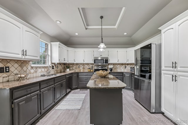 8602 S 91st E Ave, Tulsa, OK 74133 - kitchen with appliances with stainless steel finishes, white cabinets, dark stone counters, and recessed lighting