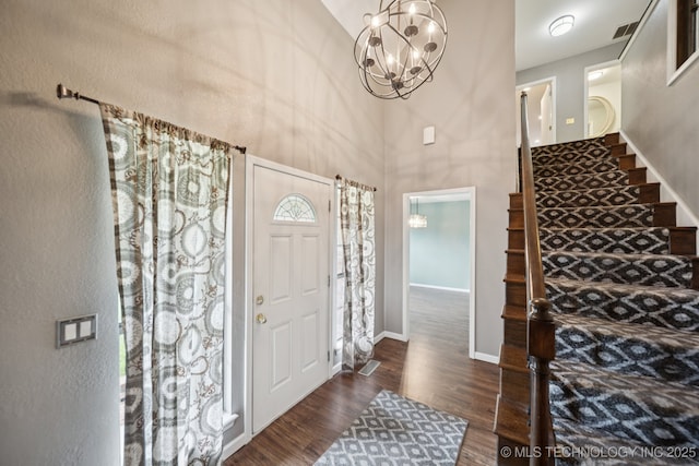 11029 E 66th St, Tulsa, OK 74133 - entryway featuring a towering ceiling, wood finished floors, a chandelier, and stairs